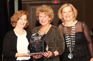 Chris MacDonell (center) receiving the ACRM Distinguished Member Award