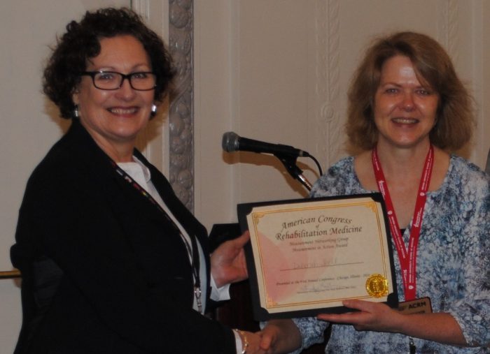 Trudy Mallinson, MNG Chair (right) presents poster award to Deborah Snell